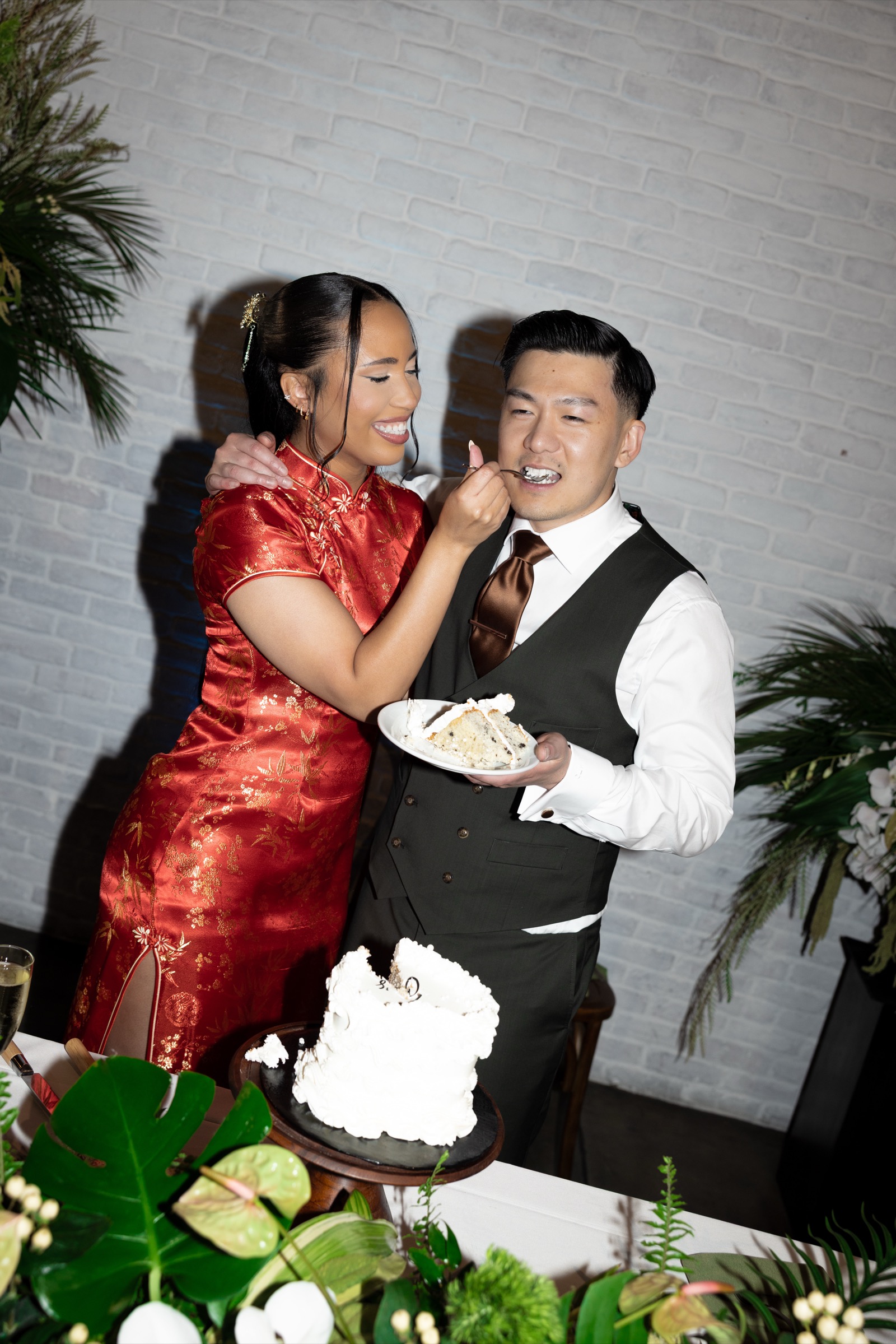 Kevin and Rachel showing off prizes during reception games at The Colony House