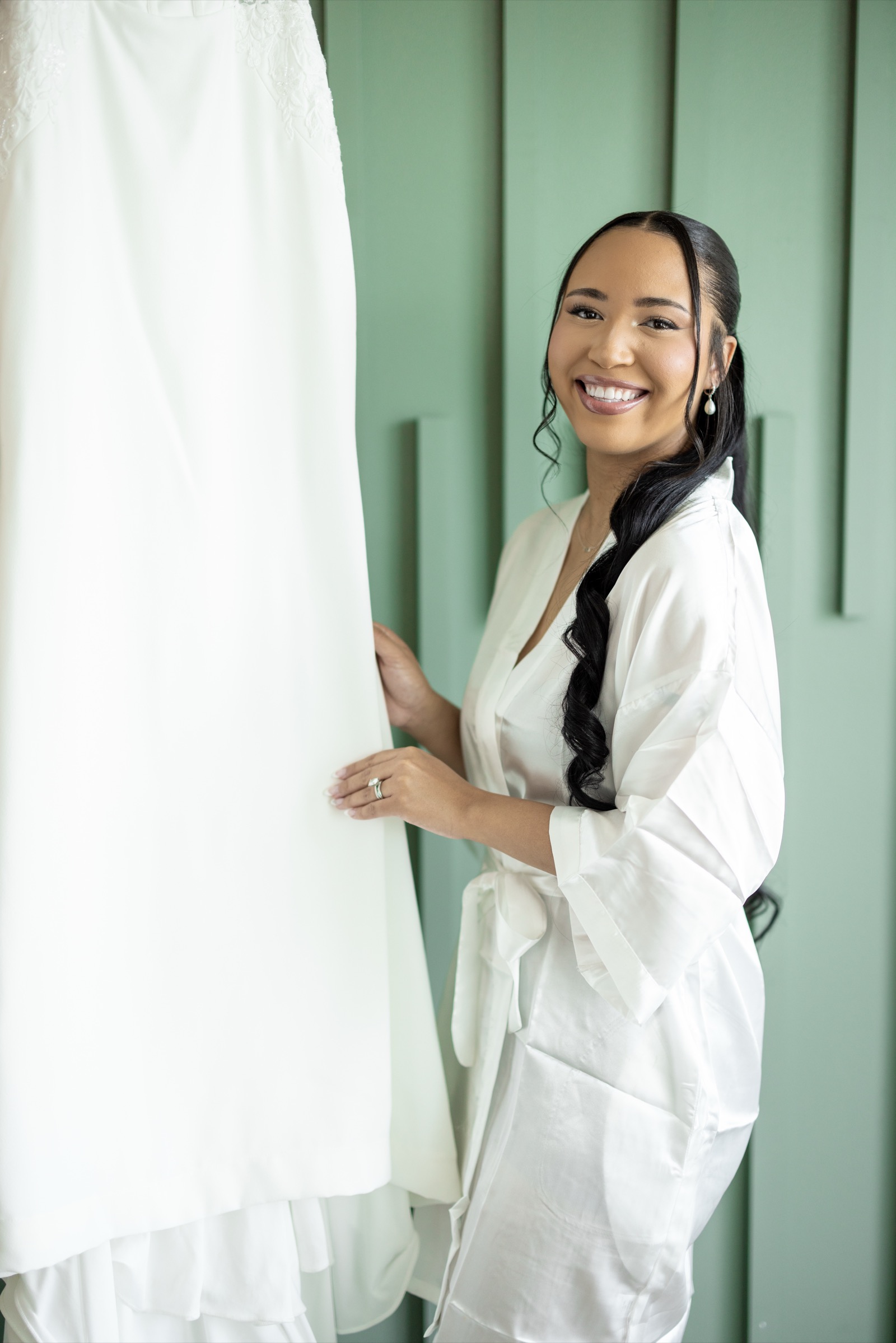 Kevin kissing Rachel on the forehead, intimate couple portrait at The Colony House