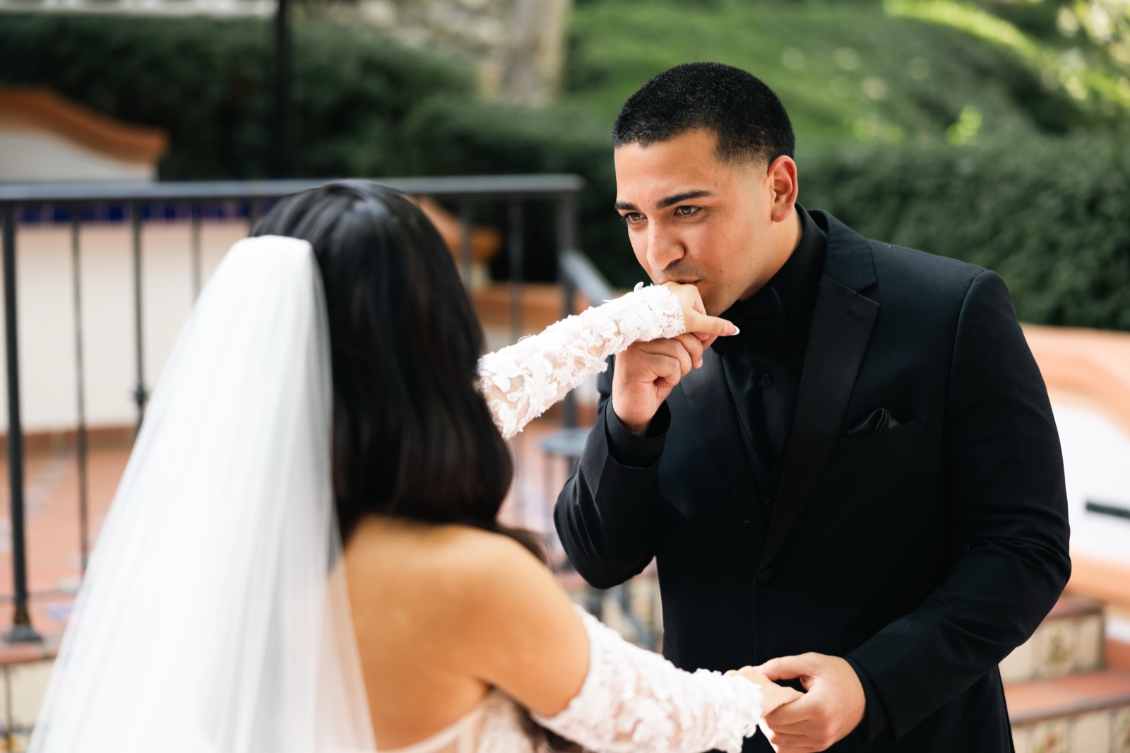 Mikey kissing Michelle's hand during first look at Rancho Las Lomas
