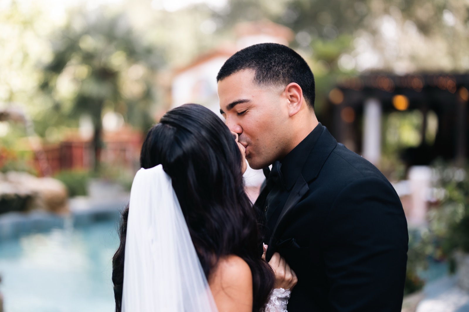 Mikey kissing Michelle by the pool at Rancho Las Lomas