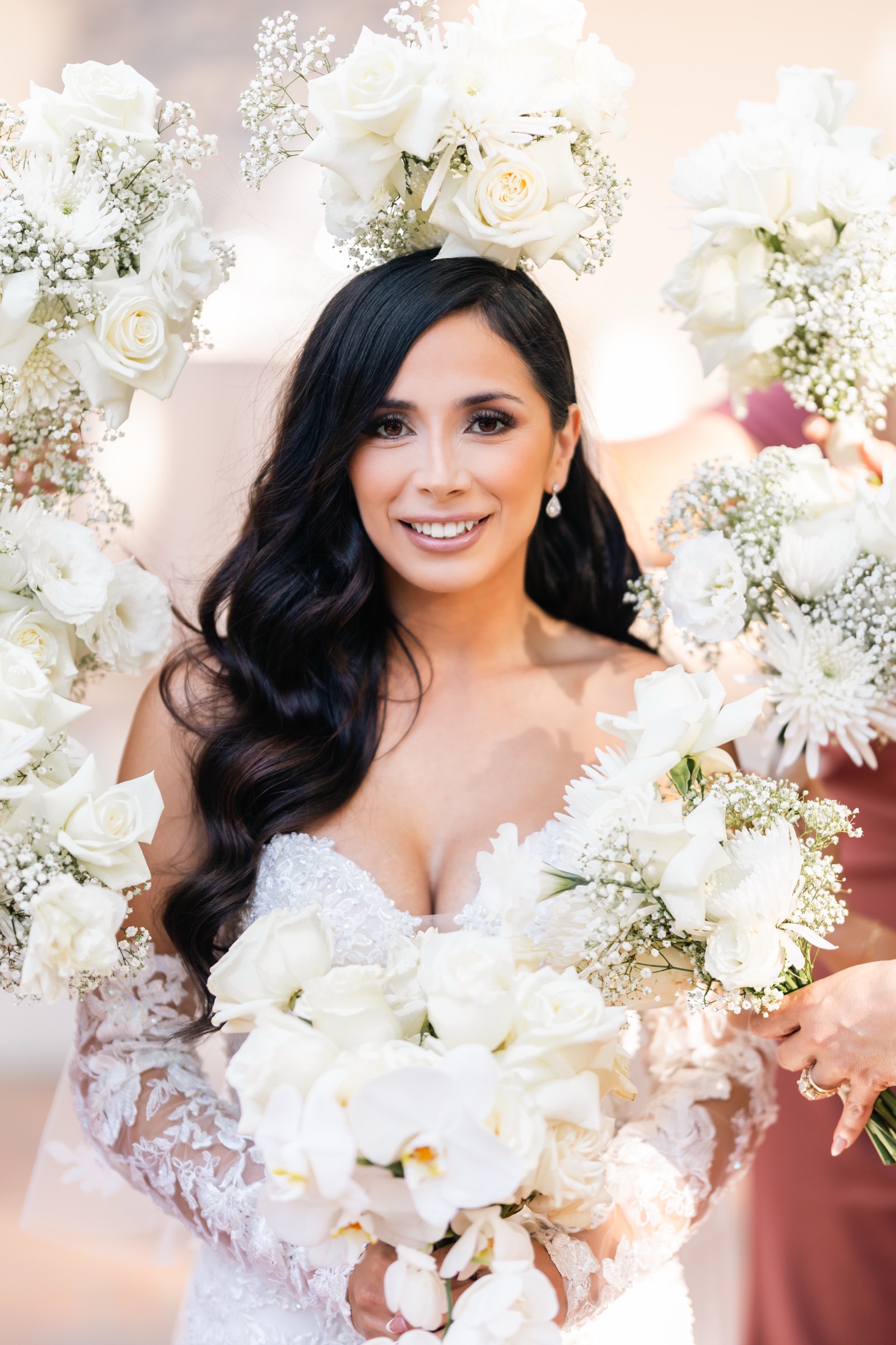 Michelle surrounded by bridesmaids bouquets at Rancho Las Lomas