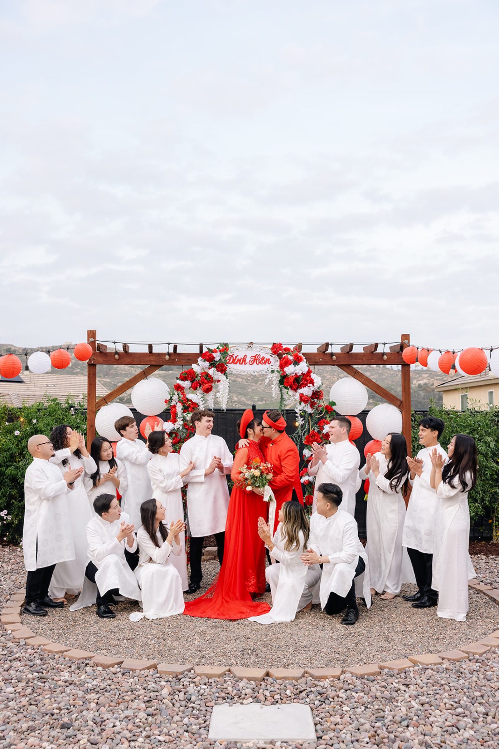 Family and friends surrounding Janet and Ryan during the tea ceremony celebration