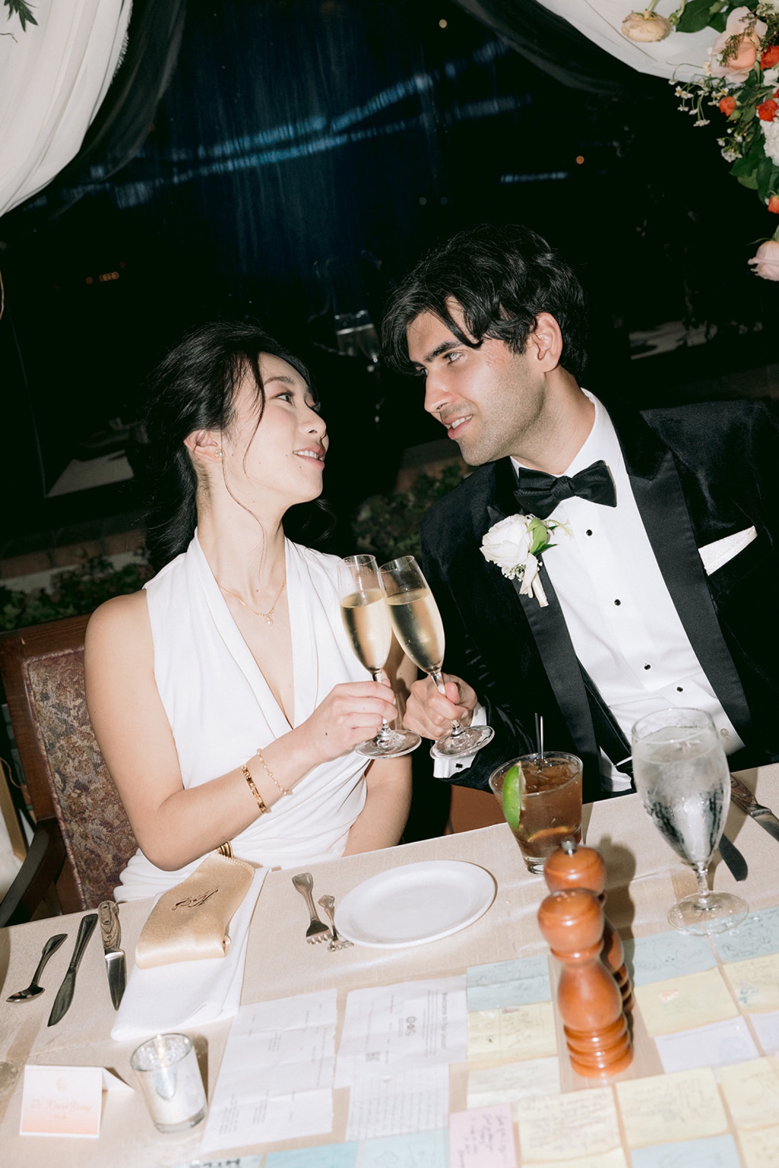 Couple toasting champagne at the reception