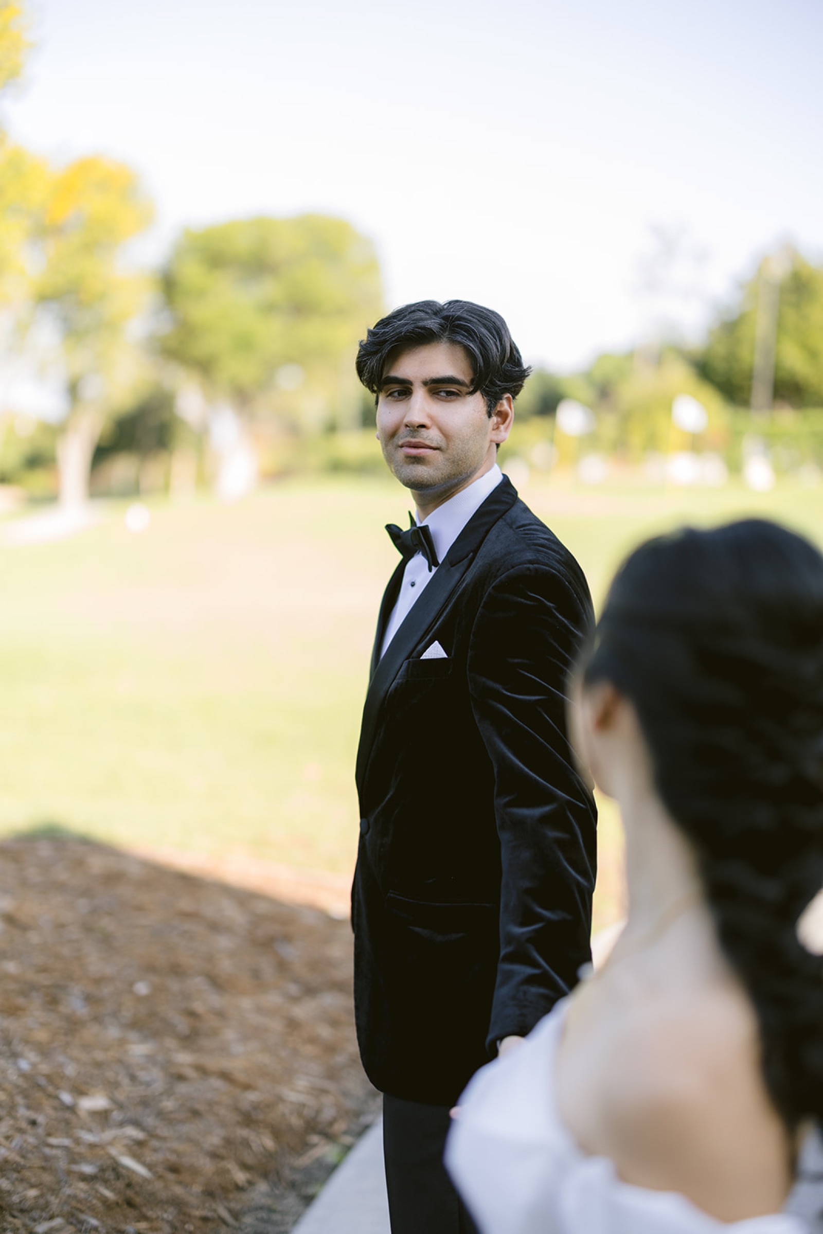 Couple walking toward the golf course at South Hills Country Club