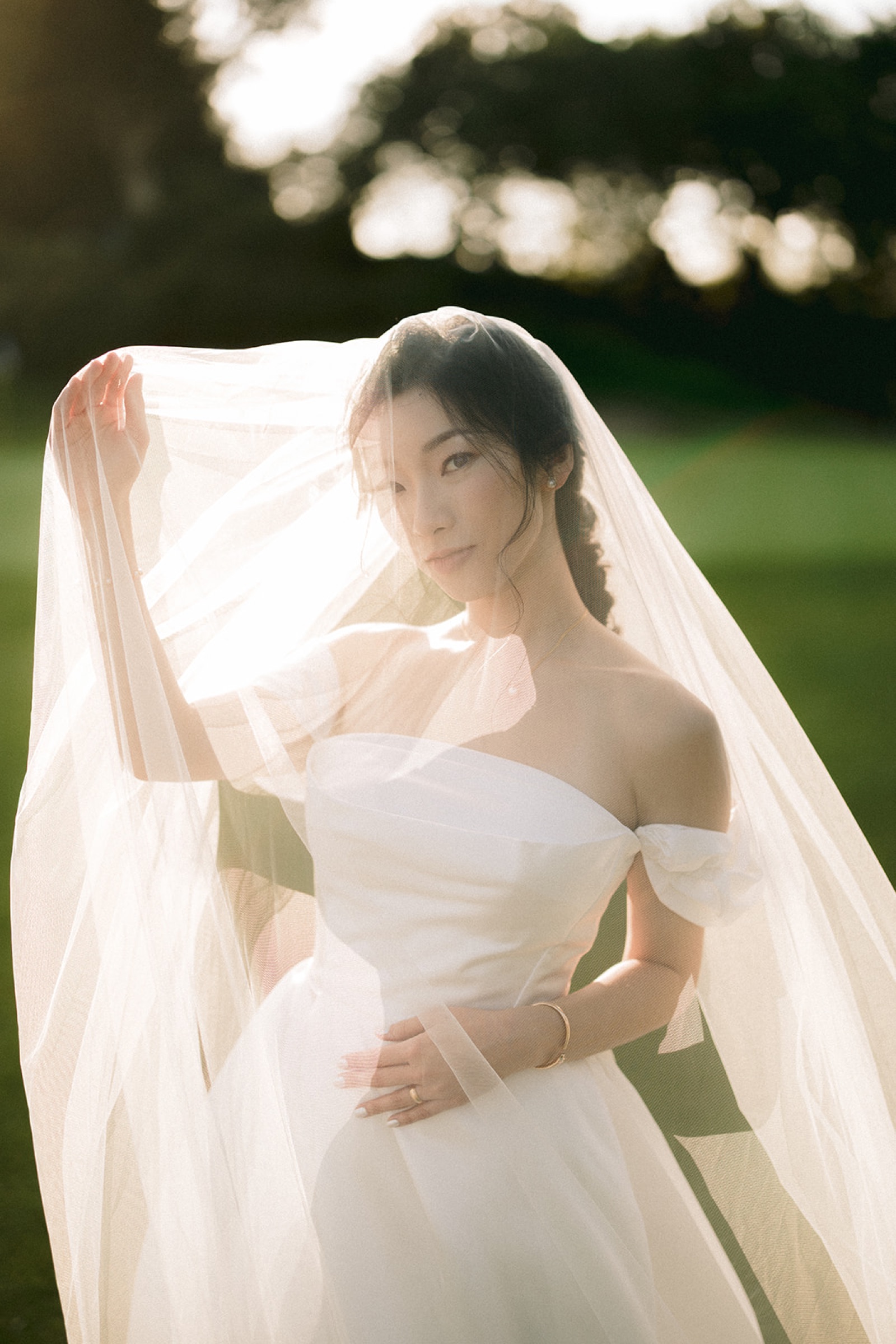 Bride portrait on the course during golden hour