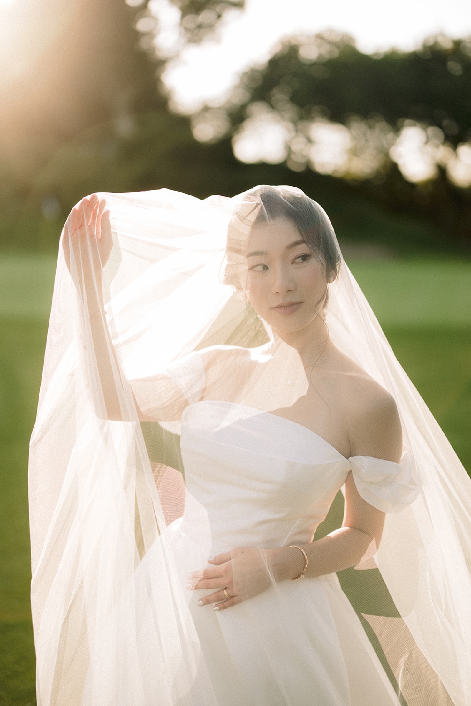 Couple walking on the golf course at sunset