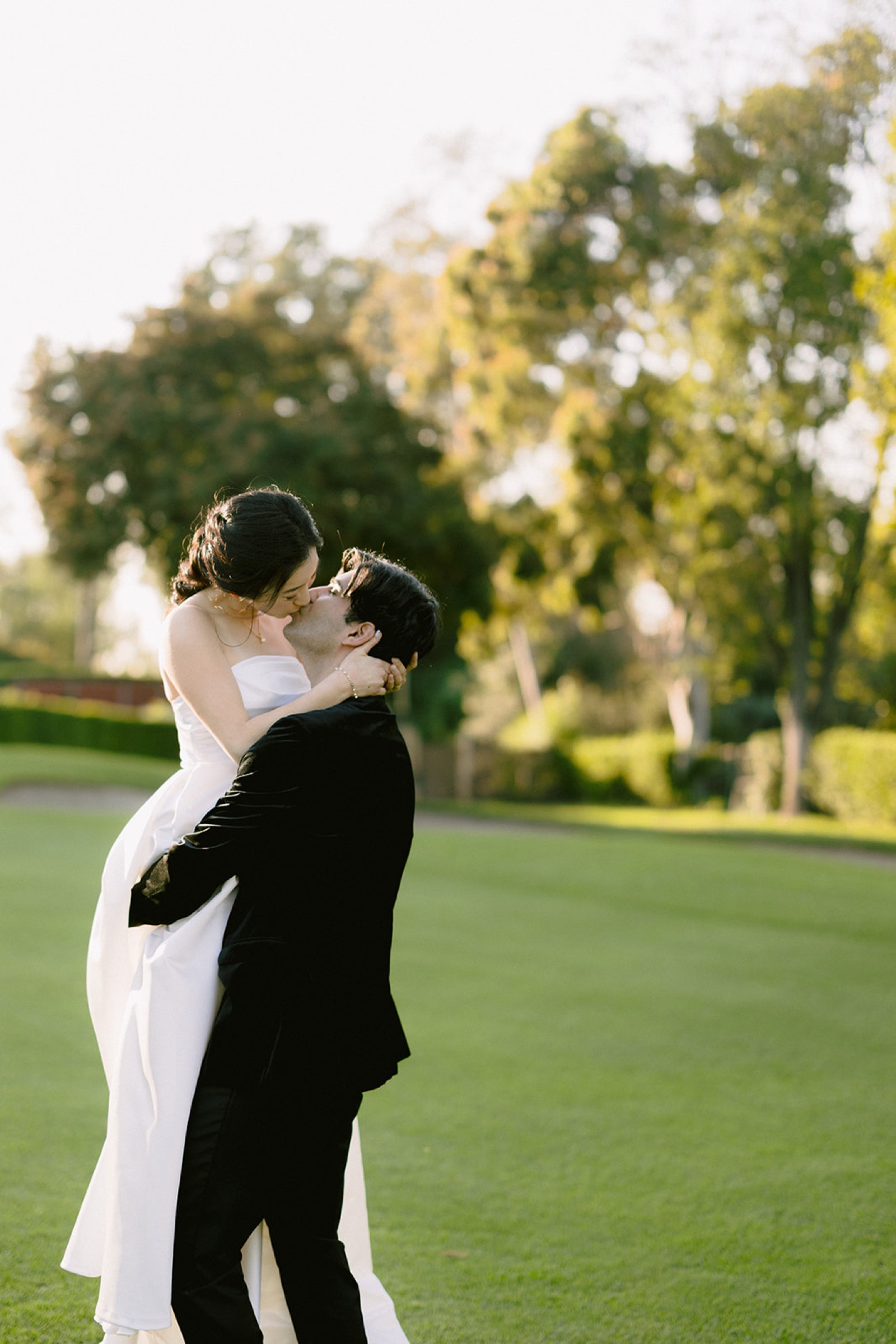Dip kiss on the golf course at sunset at South Hills Country Club