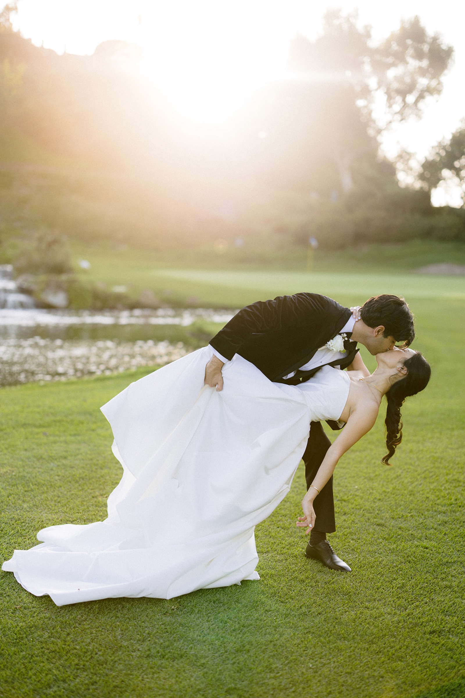 Couple kissing while walking back up the aisle after ceremony