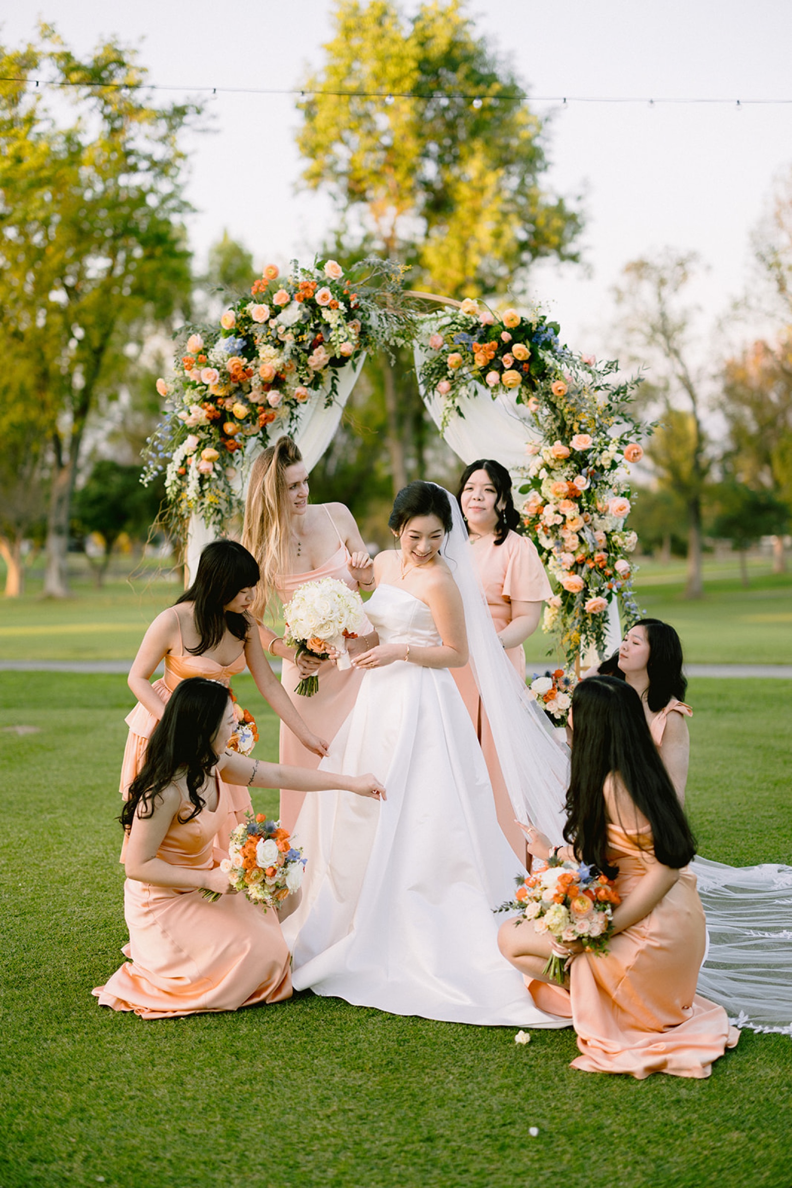 Bridesmaids laughing with bride at South Hills Country Club