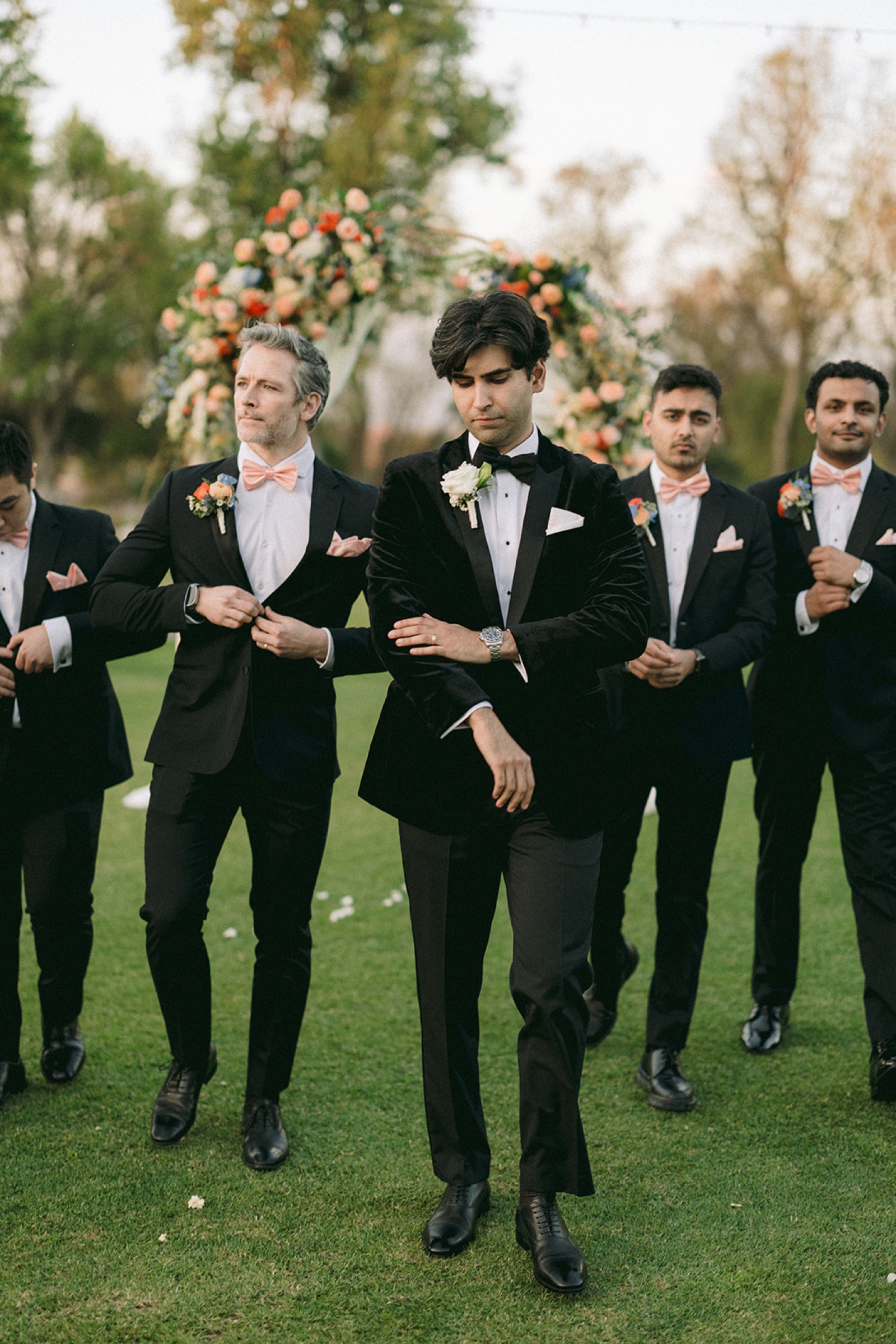Groomsmen walking together at South Hills Country Club