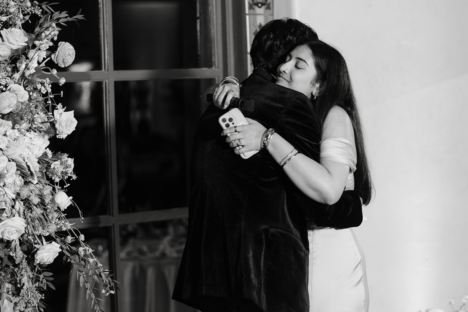 Emotional embrace during speeches at reception