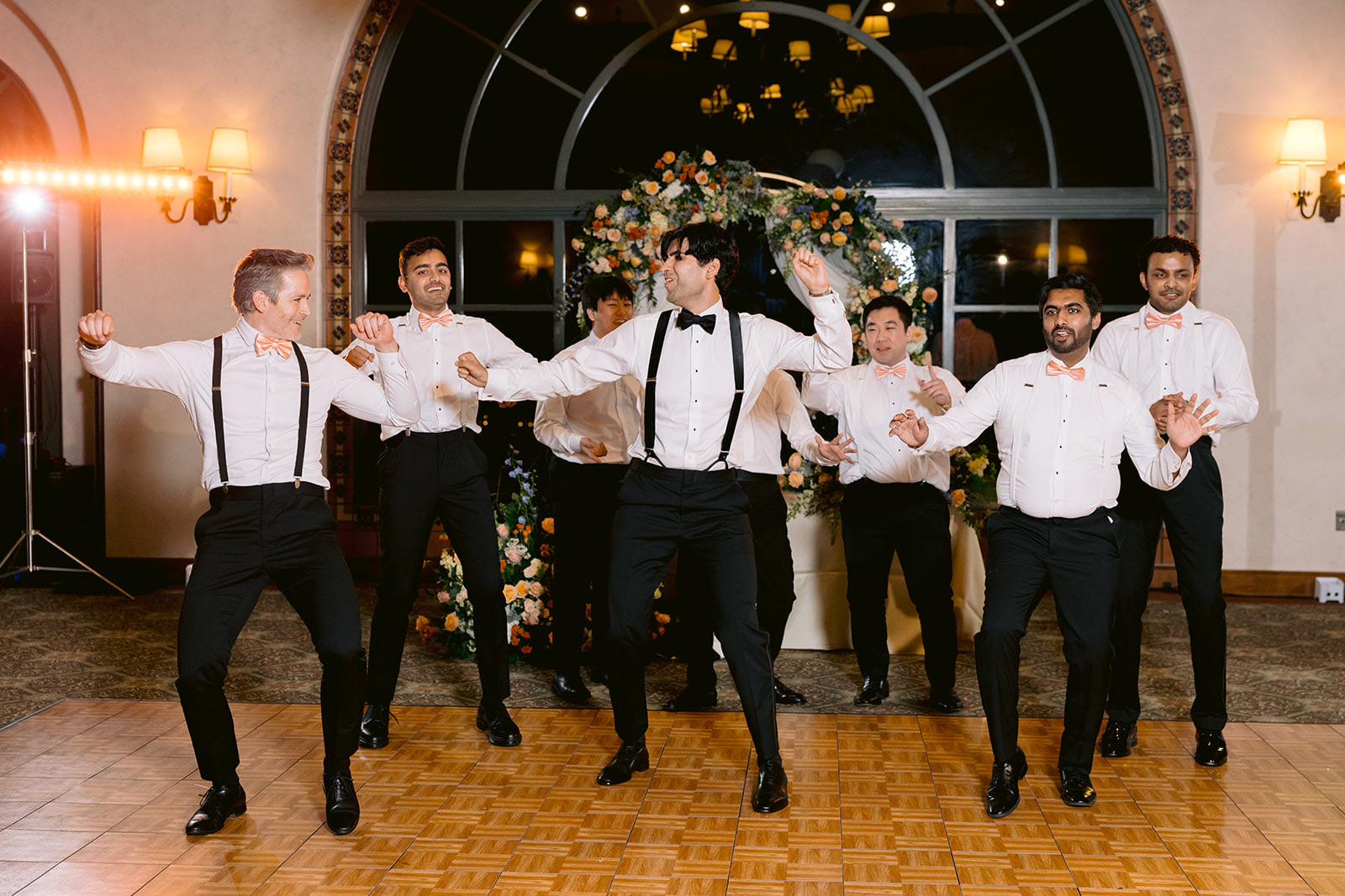 Groomsmen surprise dance performance at the reception