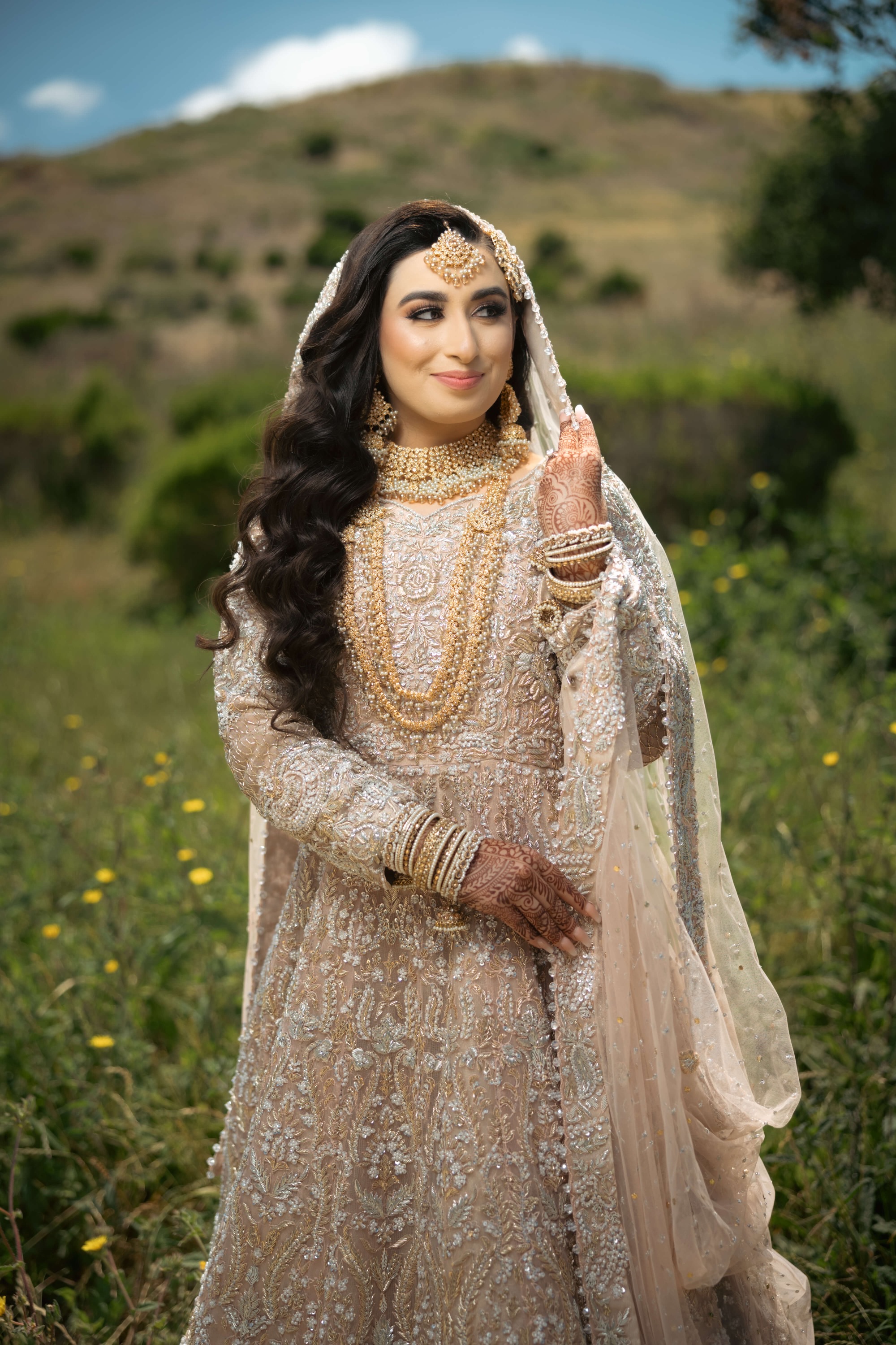 Bridal portrait in a field by Bokeh Weddings