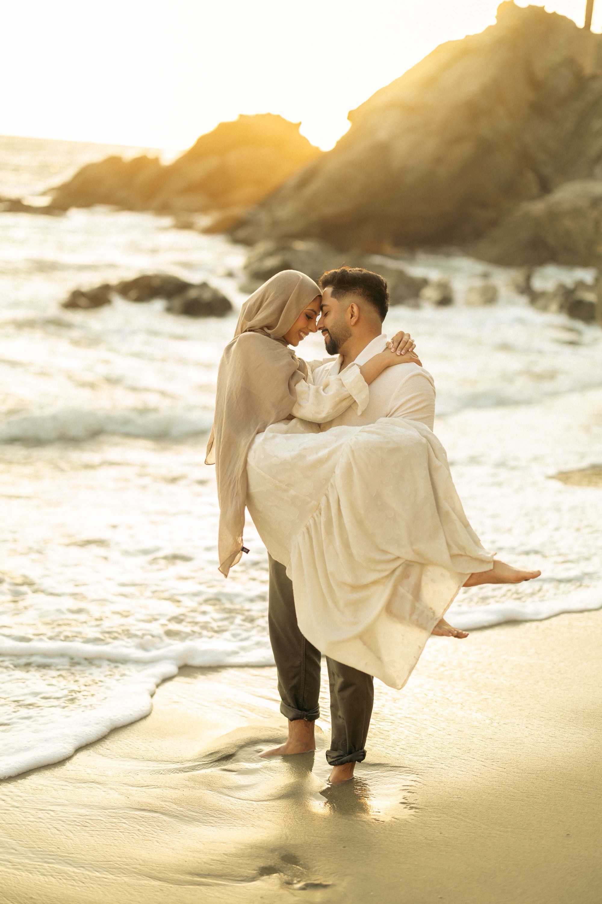 Romantic couple embracing during sunset at their California wedding